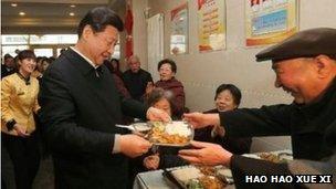 Xi Jinping being served food in a canteen