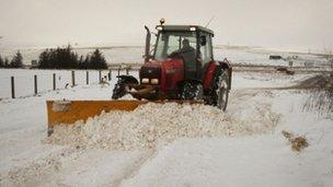 Tractor clearing snow