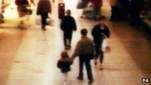 CCTV image of James Bulger being led from the shopping centre in 1993