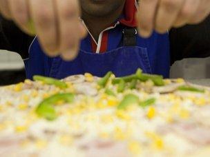 Pizza being prepared