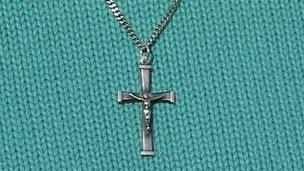 A crucifix on a necklace