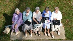 Older women having lunch on a bench