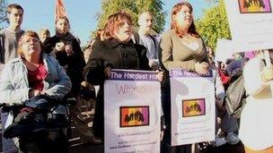 Disability protesters holding banners