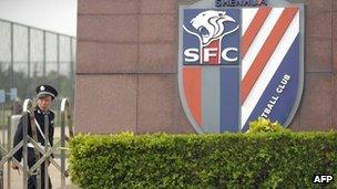 Police officer outside Shanghai Shenhua