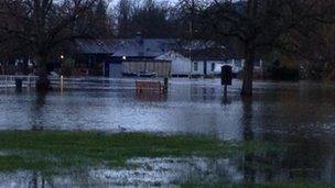 A bench in a flooded field