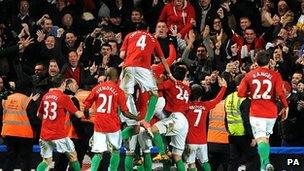 Swansea players celebrate beating Chelsea in the semi-final first leg