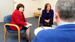 Two women and man in a meeting