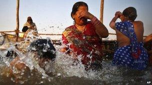 Pilgrims bathe at Sangam on 14 Feb 2013