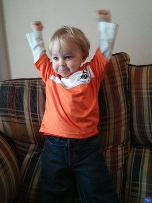 Young fan Rex who is almost two cheering the Swans on from home in Swansea. Photo sent in by Martyn and Cassy