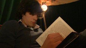 Nick Pryke reading a book
