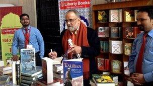 Ahmed Rashid signing books