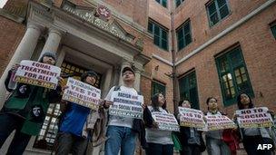 Demonstrators display placards asking for equal rights outside the Court of Final Appeal in Hong Kong, 26 February 2013