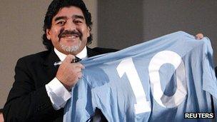 Diego Maradona with a number 10 shirt