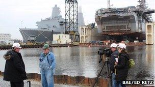 Mark Mardell doing an interview with Tom Ehret in a military shipyard in Newport News, Virginia 26 February 2013