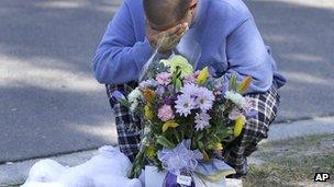 Jeremy Bush lays flowers near the house. 2 March 2013