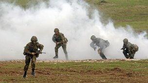 Soldiers from the British Army take part in a training exercise on Salisbury Plain, Wiltshire.