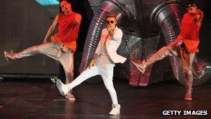 Justin Bieber with two backing dancers at Monday's concert