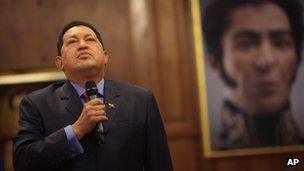 Hugo Chavez in front of a portrait of Simon Bolivar, 9 October 2012