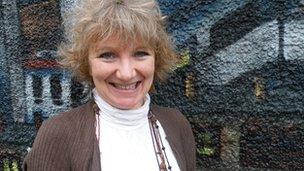 Dr Zeedyk in front of a graffiti covered wall