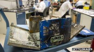 The damaged battery case from a fire aboard a Japan Airlines (JAL) Boeing 787 Dreamliner airplane at Logan International Airport in Boston