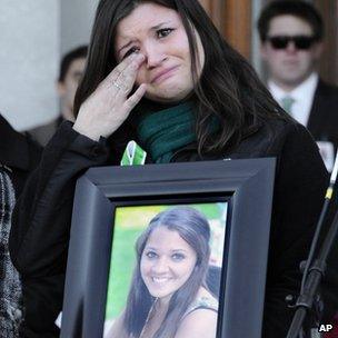 Heather Cronk carries a photograph of her cousin, Victoria Soto, who died in Sandy Hook massacre