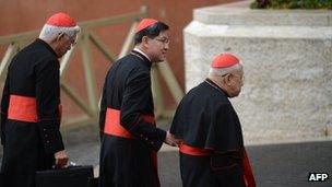 Philippines cardinal Luis Antonio Taggle (C) arrives with other cardinals for a meeting of pre-conclave on March 9