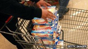 A customer stacks up Twinkies cakes