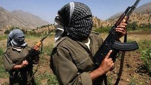 A picture taken in June 2007 of PKK fighters patrolling an area in the Iraqi part of the Qandil mountains near their headquarters on the Iraqi-Iranian-Turkish borders