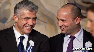 Yair Lapid (left) and Naftali Bennett (right) at a reception marking the opening of the 19th Knesset on 5 February, 2013.