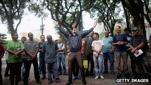 A Protestant (C) preaches to a crowd outside the Se Cathedral, the cathedral of the Roman Catholic Archbishop of Sao Paulo, Cardinal Odilo Pedro Scherer,
