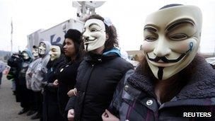 Protesters in masks outside the court