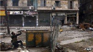 A Syrian rebel aims his weapon during clashes in Aleppo. Photo: March 2013