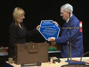 Revered Ron Lancaster is presented with a plaque