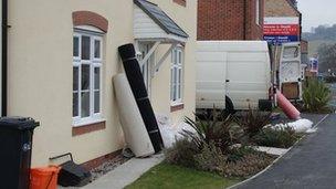 Carpets outside a house on the Glasdir estate