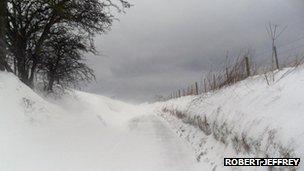 drifting snow on road