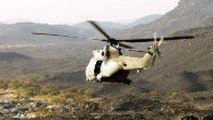 French helicopter flying over the Adrar of Tigharghar mountain range