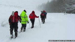 Motorists being escorted off the moorland