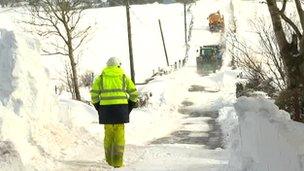 NIE worker on snow covered road