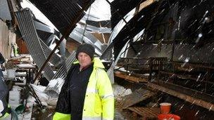 James McHenry in the shed where sheep were killed when the roof collapsed