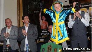 Oscar Knox in boxing robes.