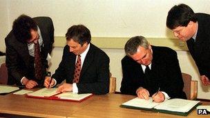 The then UK Prime Minister Tony Blair (left) and Irish Prime Minister Bertie Ahern sign the deal