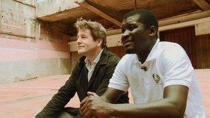 Leo Johnson and Quelimane mayor Manuel de Arajuo survey the city's derelict cinema