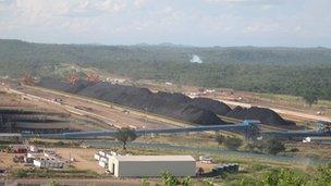 Coal is stockpiled above ground while waiting to be transported to port