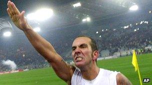 Paolo Di Canio gives a straight arm salute to Lazio supporters in 2005