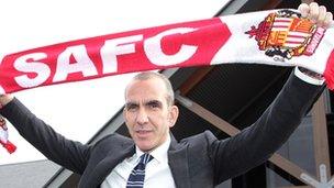 Paolo Di Canio with a Sunderland scarf after being named the club's manager