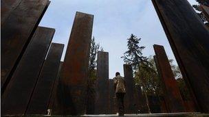 Man walks past the controversial memorial