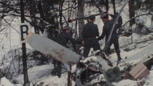 People examining the wreckage of the plane at Basle on 10 April 1973