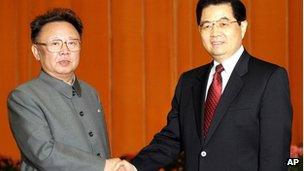 Chinese President Hu Jintao, right, shakes hands with North Korean leader Kim Jong Il, left, at Beijing's Great Hall of the People on Tuesday January 17, 2006.