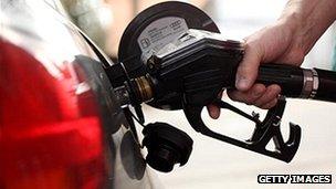 close-up of car being filled with petrol