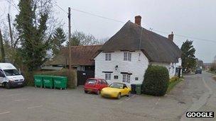 The green bins located in the car park of the Fox Inn in Denchworth